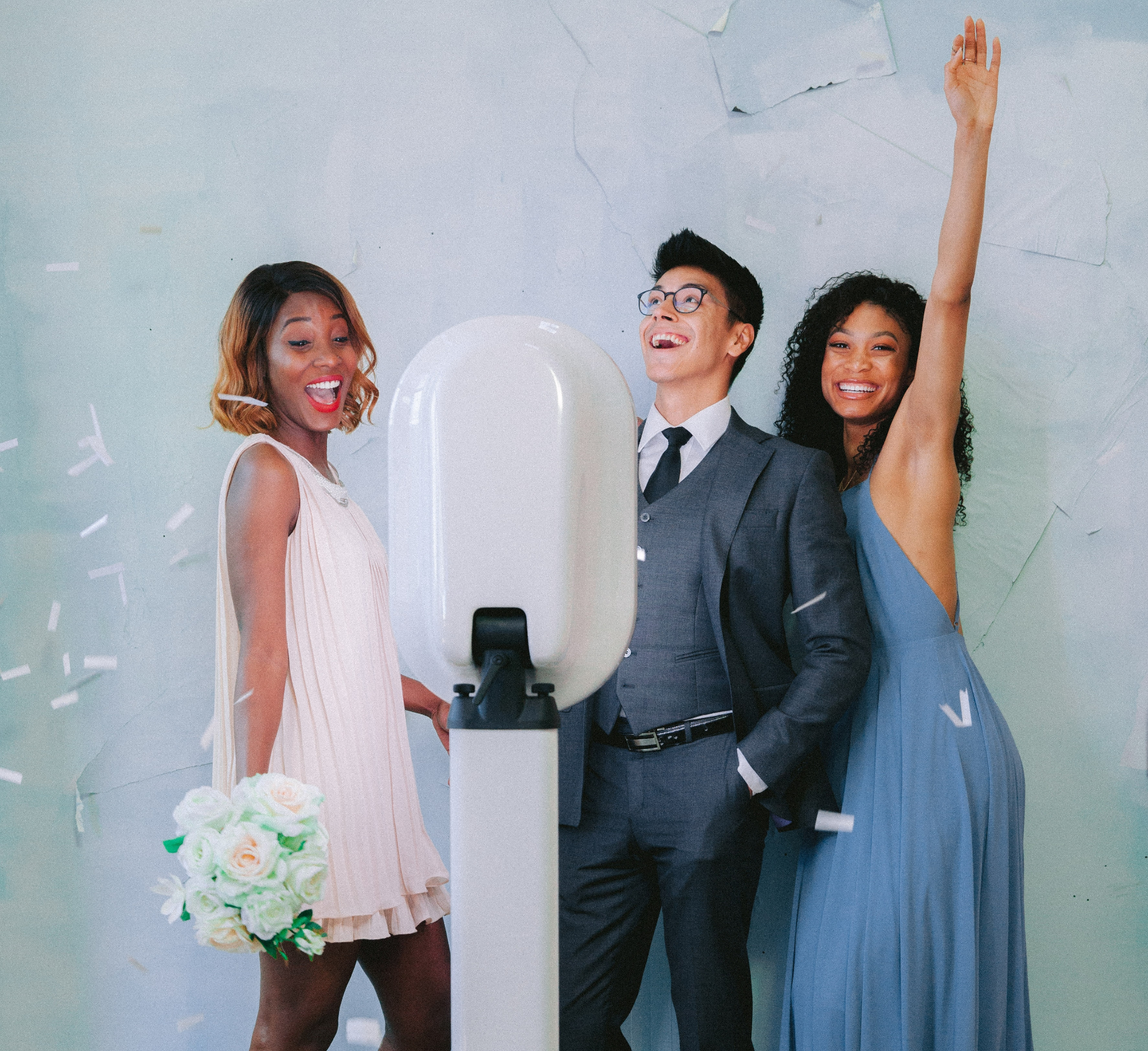 Wedding guests posing at a photo booth rental in NYC